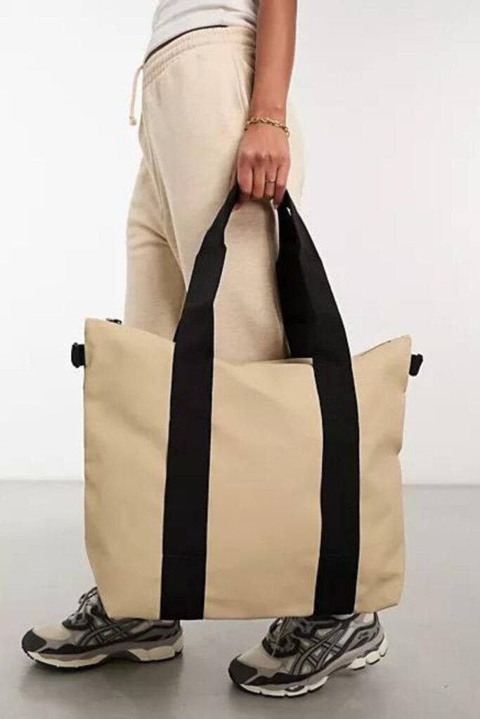 beige and black waterproof travel tote bag