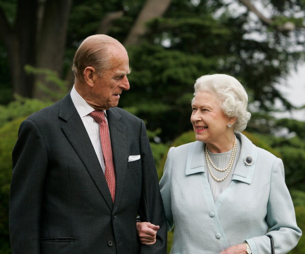 Queen Elizabeth II and Prince Philip smiling together.