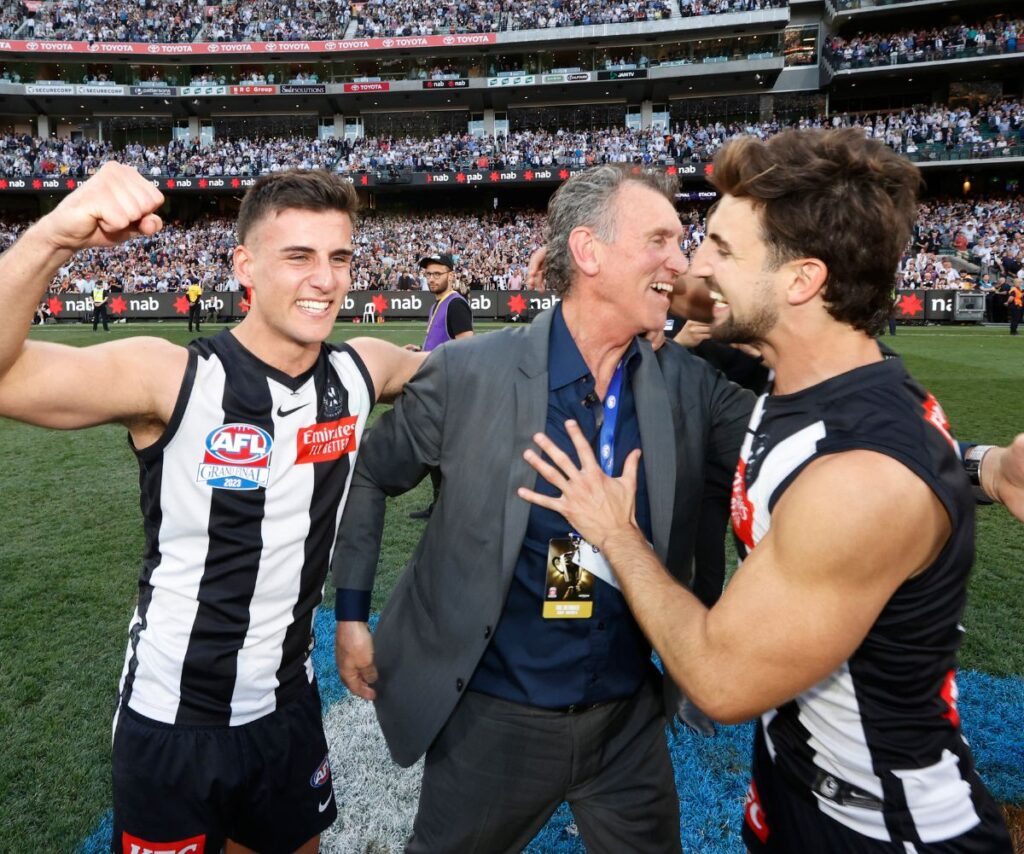 Peter Daicos with sons Nick Daicos and Josh Daicos after the Collingwood Magpies won the 2023 AFL Premiership.