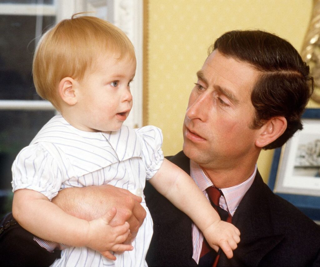 A young King Charles with infant Prince Harry.