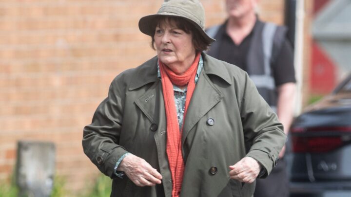 Brenda Blethyn as Vera, wearing red scarf, hat and coat