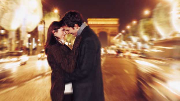 Couple kissing in Paris