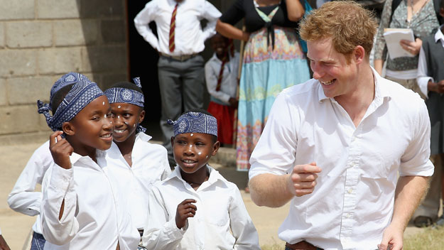 Prince Harry charms African schoolkids with dad dancing