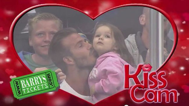 David Beckham and Harper Beckham kiss on camera.