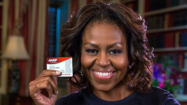 Michelle Obama with her AARP card on her 50th birthday