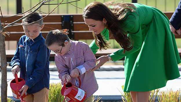 Oliver and Sebastian water the oak tree with Kate Middleton
