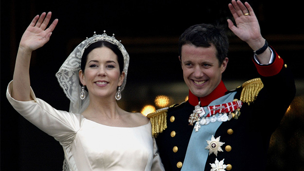 Crown Princess Mary and Crown Prince Frederik wave to crowds on their wedding day on May 14, 2004.