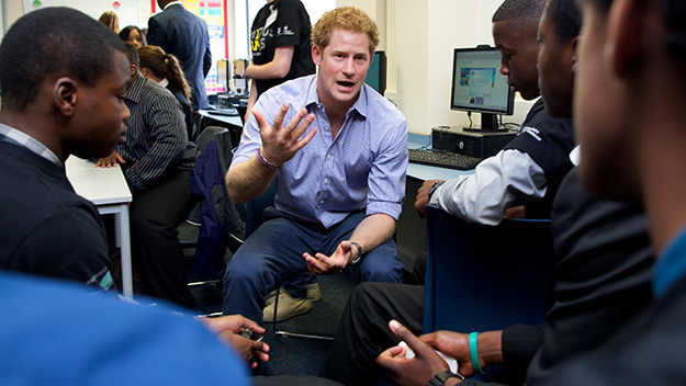 Prince Harry talks with students about the upcoming Invictus Games.
