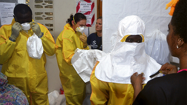 Staff from Samaritan's Purse put on protective in the ELWA hospital in Liberia.