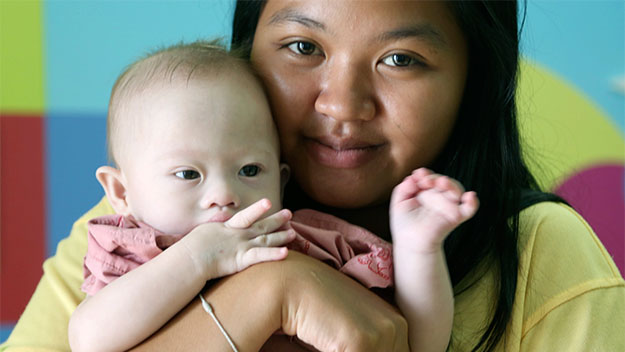 Surrogate mother Pattaramon Chanbua, 21, with baby boy Gammy
