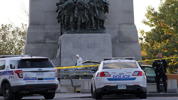 orensic police officers at the National War Memorial in Ottawa, Canada where a gunman killed a soldier.
