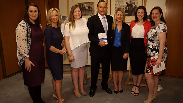 Prime Minister Tony Abbott with editor-in-chief Helen McCabe and the Women of the Future winners. Picture: Andrew Meares