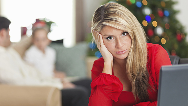Woman feeling stressed at Christmas time. 