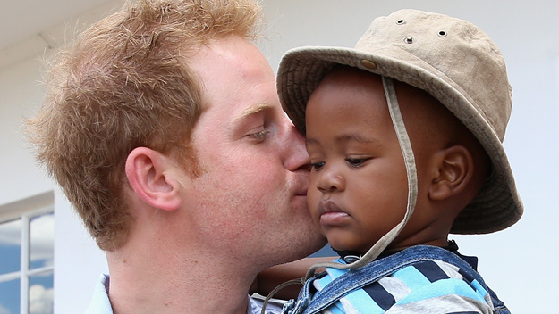 Prince Harry kissing African child