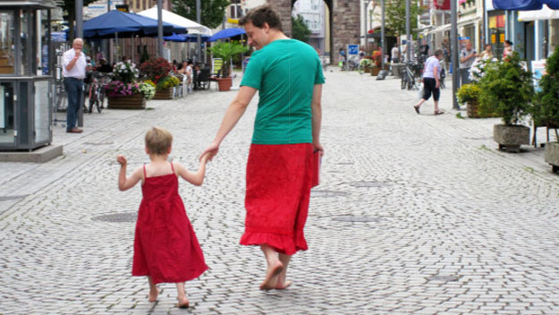 Father with daughter walking