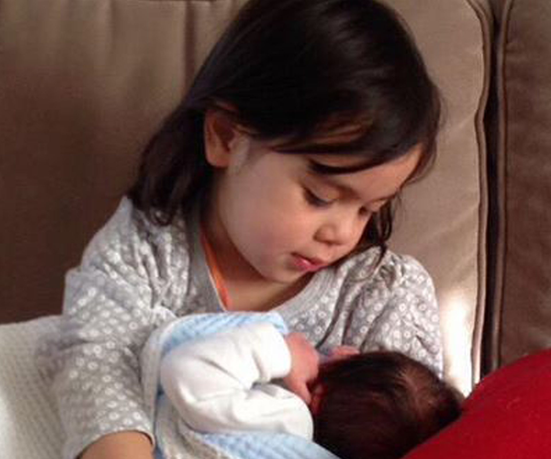 Penny Wong's daughter, Alexandra, holds baby Hannah