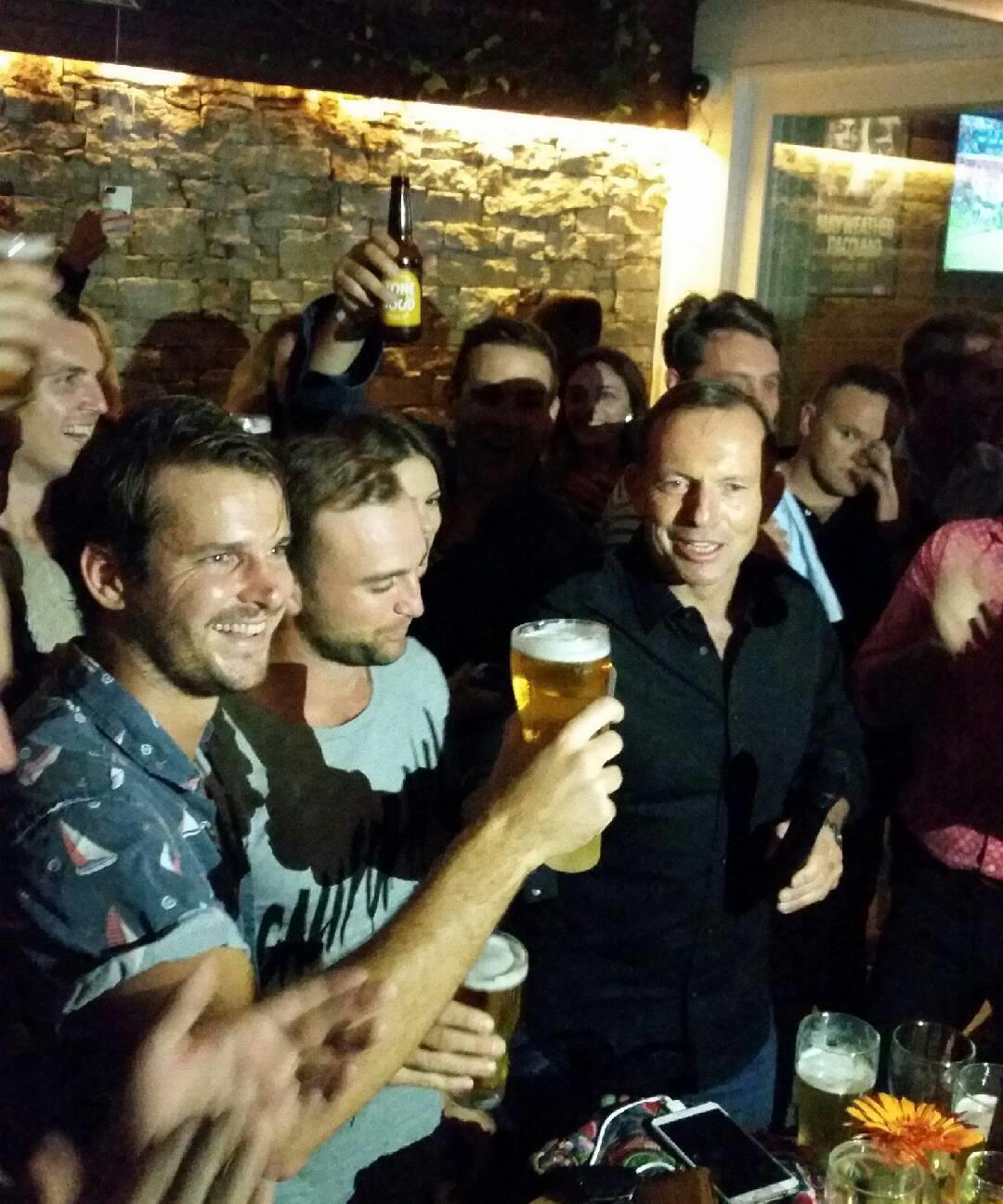 Tony Abbott skolls a beer at Sydney pub