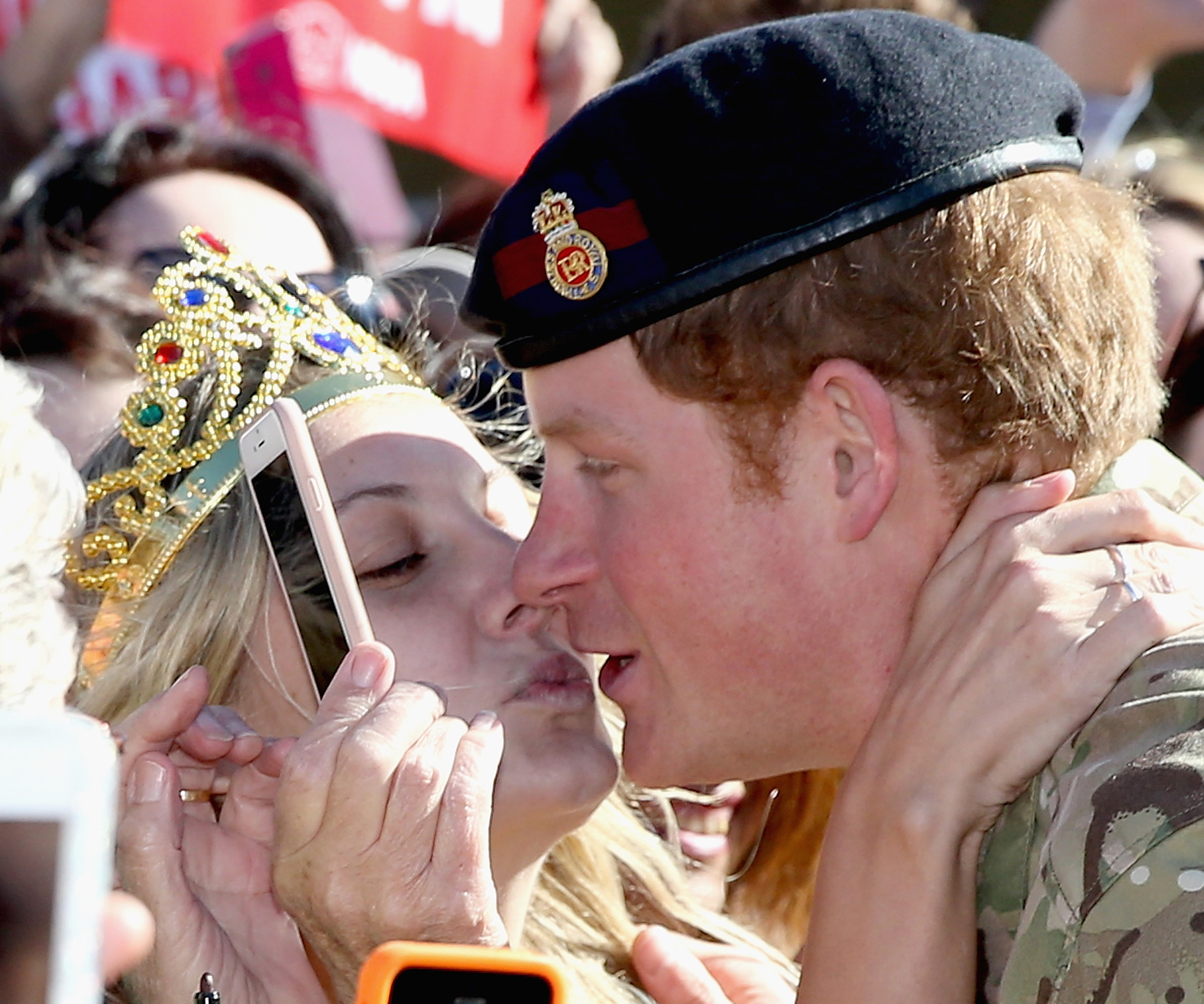 In for the kiss! Excited fans flock for Prince Harry