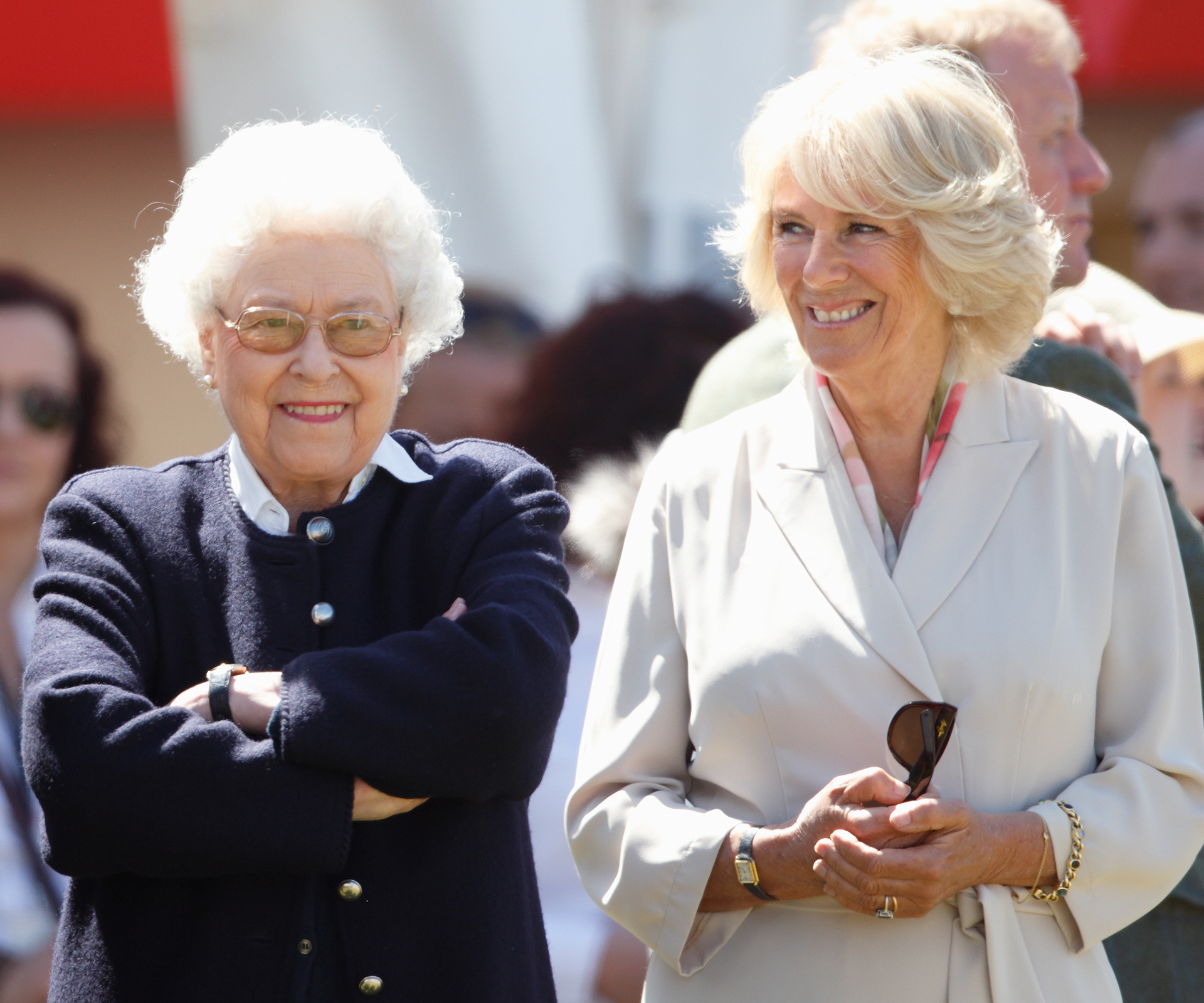Kisses and curtsies: Camilla and Queen Elizabeth share a giggle