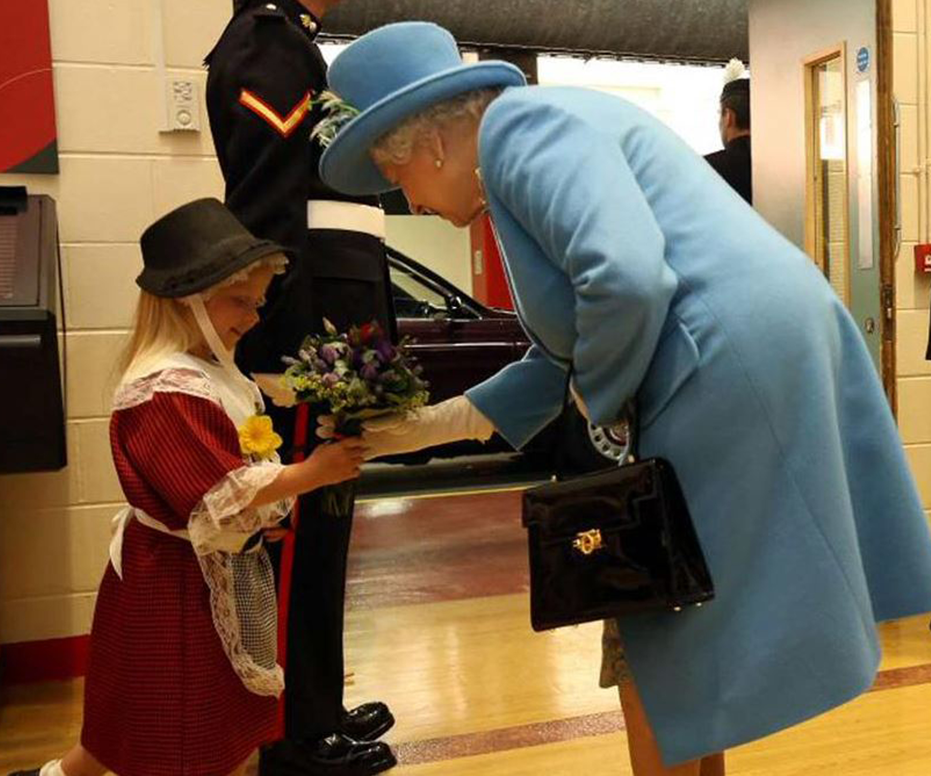 Oopsie Maisie: Child hit in face by saluting soldier after meeting the Queen