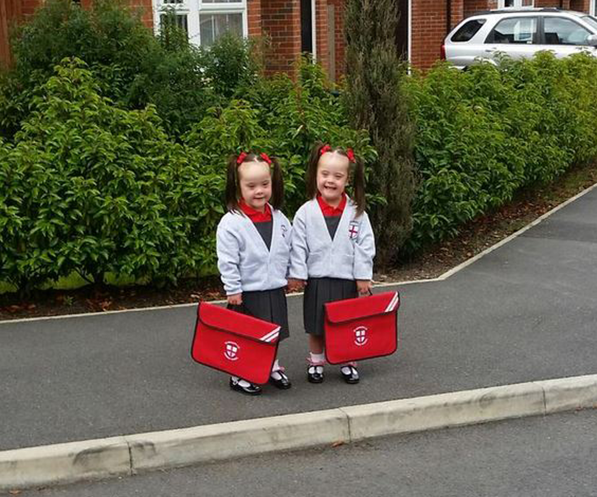 Double the joy! Twin girls with Down syndrome start school