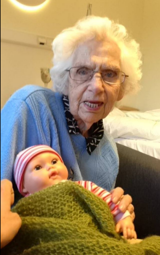 Amazing pictures of grandmother caring for baby doll go viral