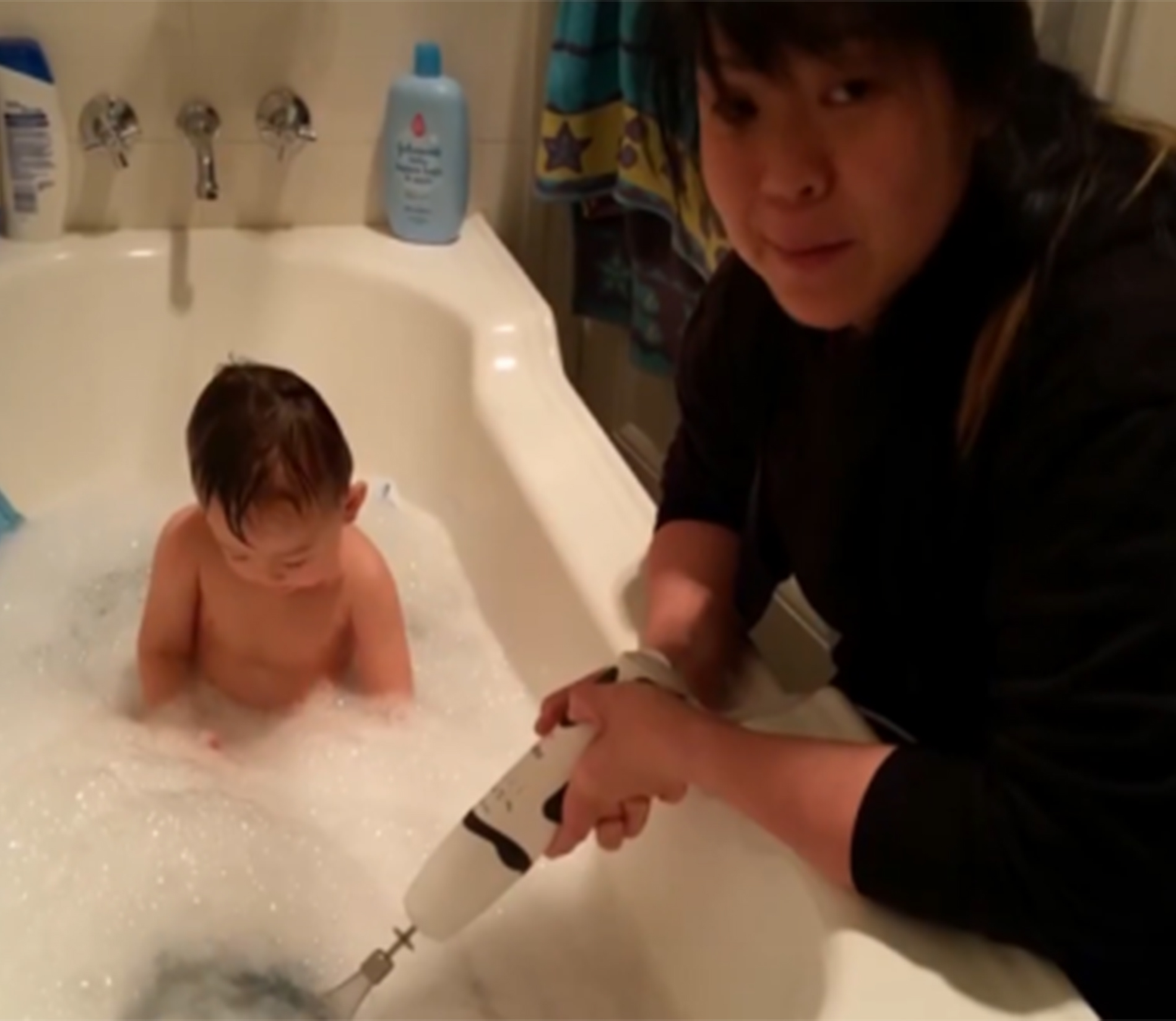 Baby's bubble butt bath time with electric beater