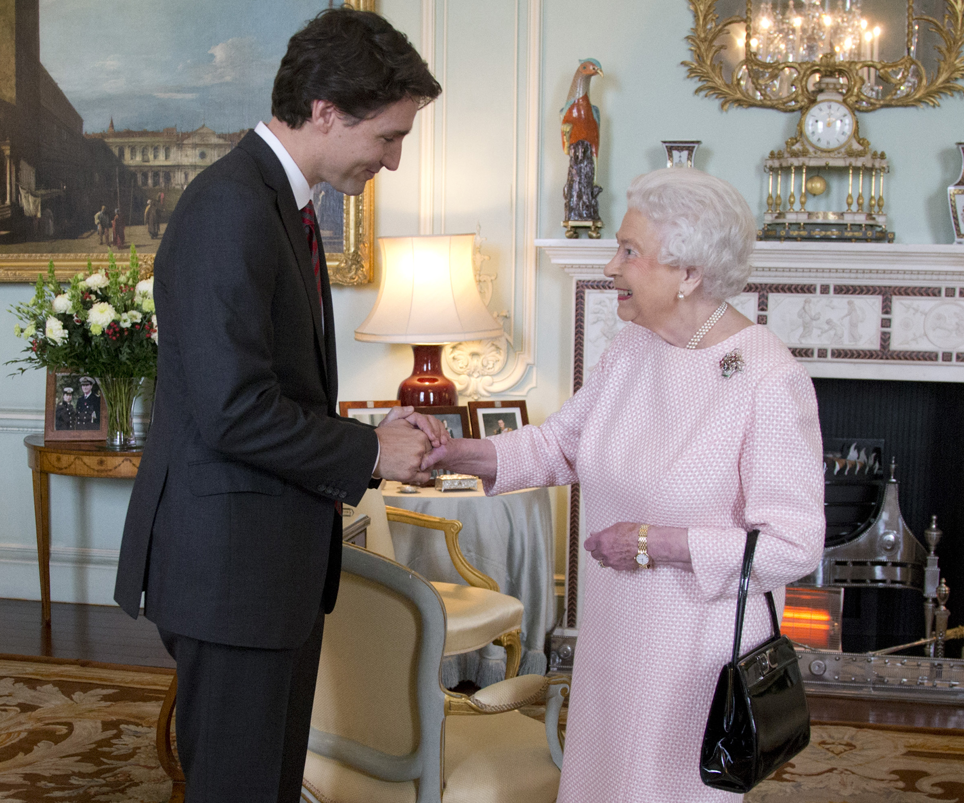 Queen Elizabeth shares a flirty exchange with Canada’s handsome prime minister