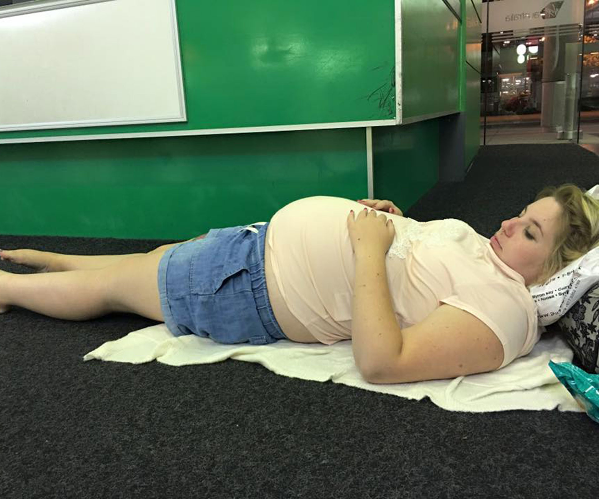 Pregnant woman forced to sleep on airport floor