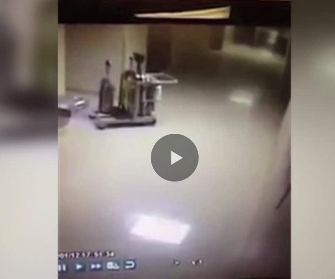 Ghost pushes cleaning trolley through school