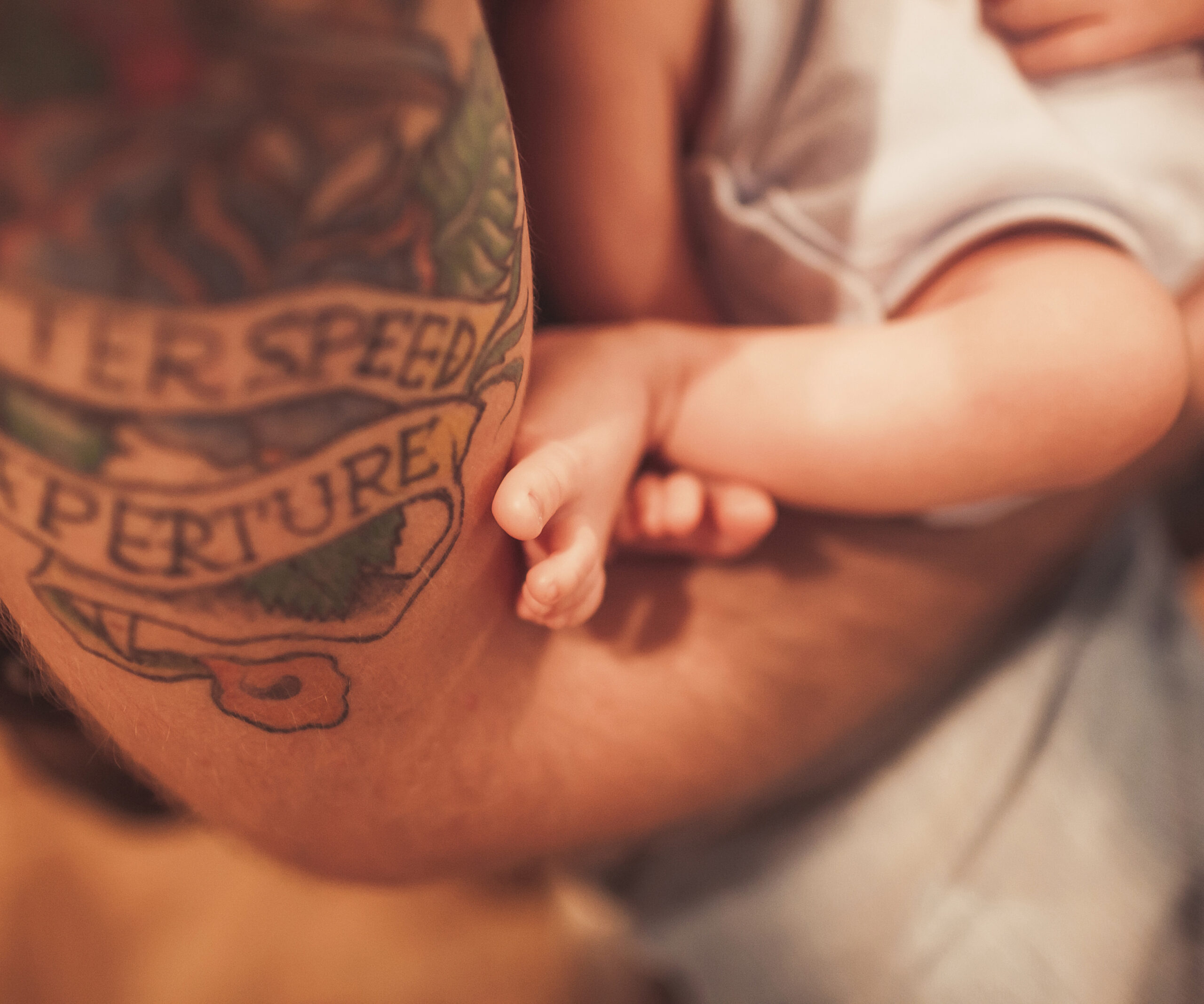 tattooed dad with baby