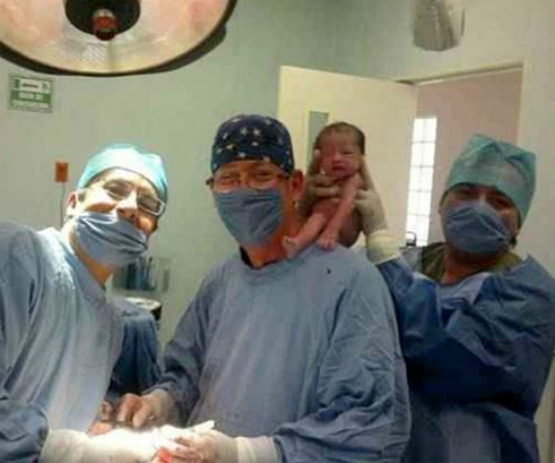 Doctors shamed for bizarre selfie with a newborn