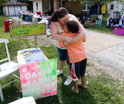 Boy sets up lemonade stand to pay for own adoption
