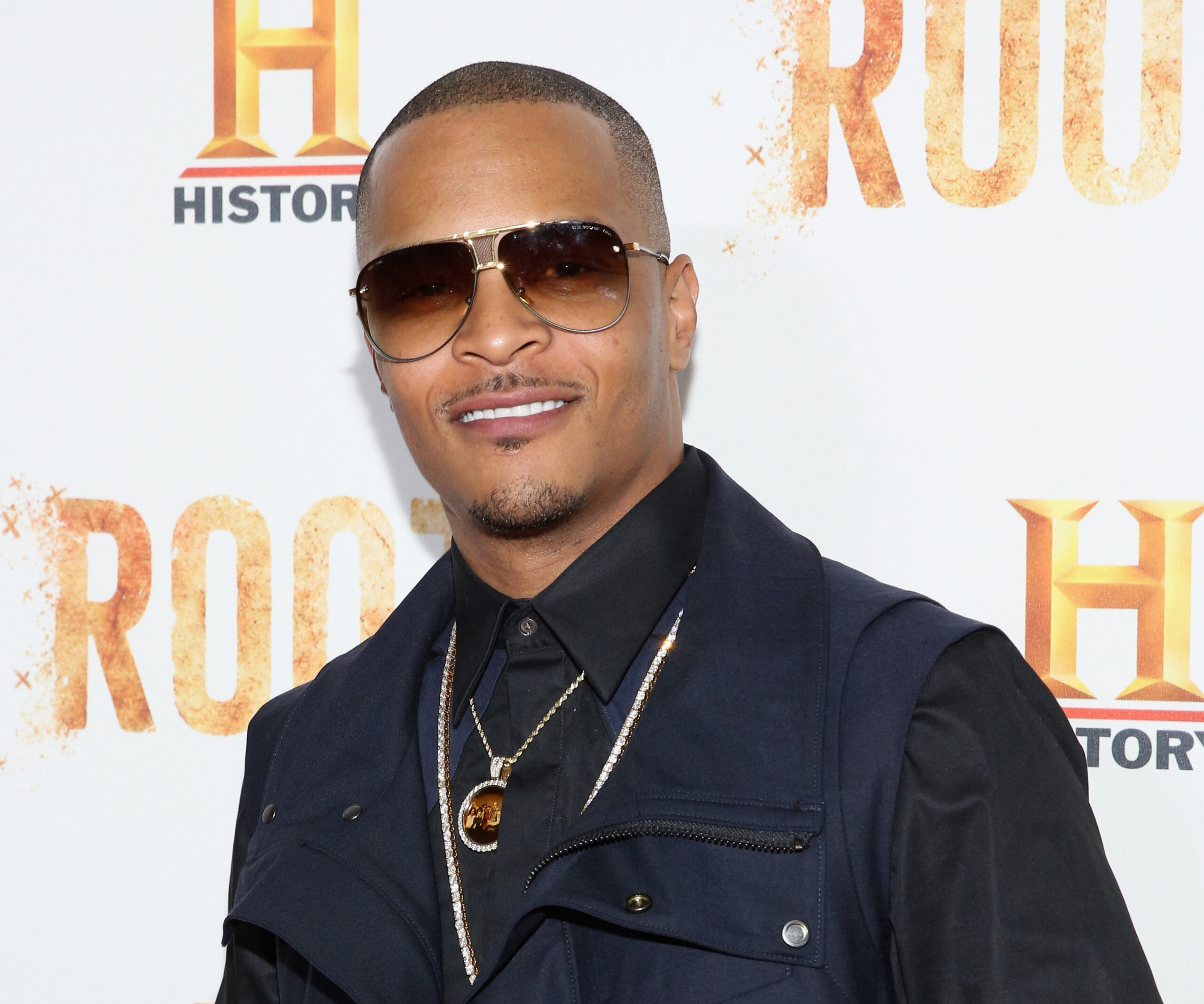 One dead, three wounded in shooting at rapper T.I. concert