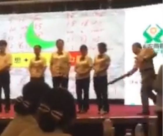 Chinese bank staff publicly spanked for poor performance