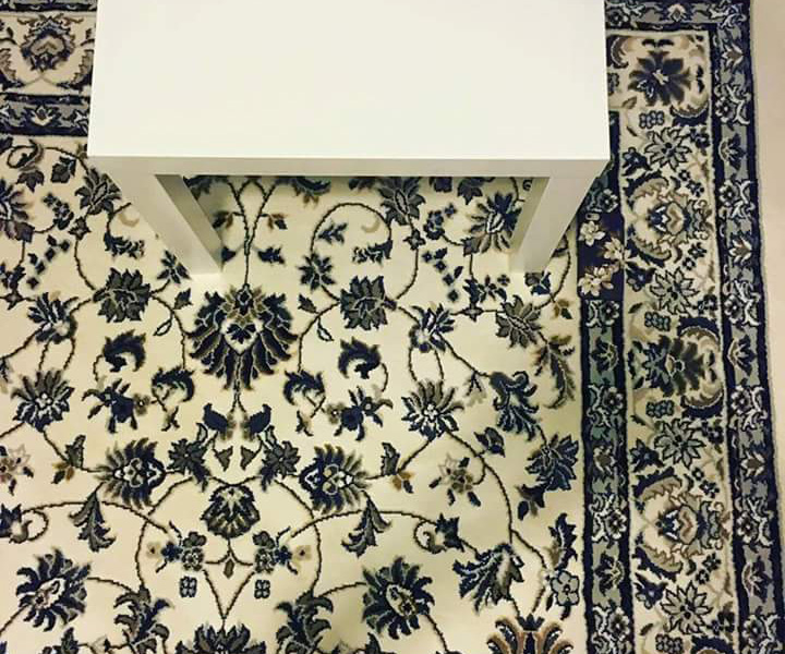 Can you find the phone hidden on this rug?