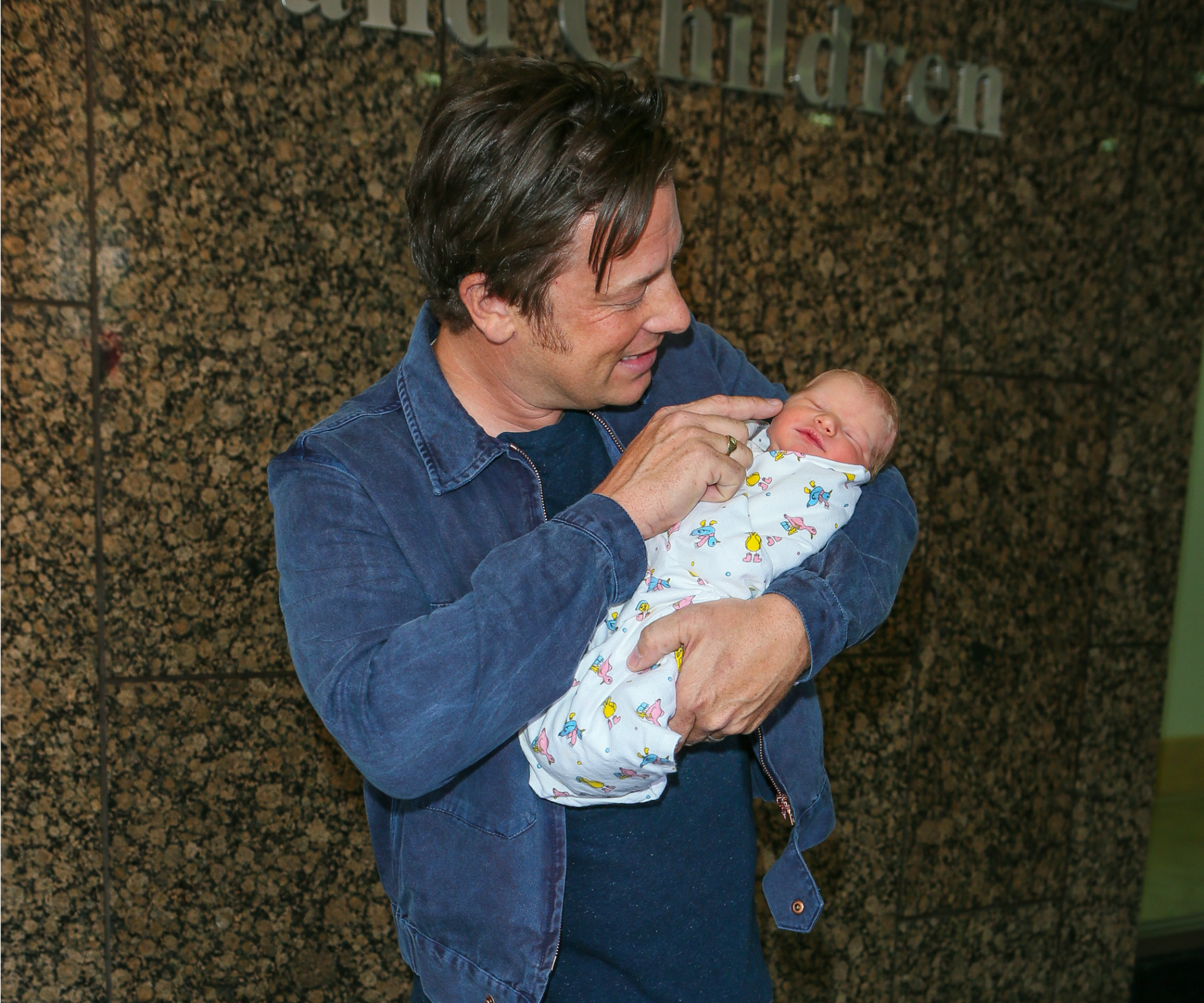 Jamie Oliver shares first outing with newborn baby