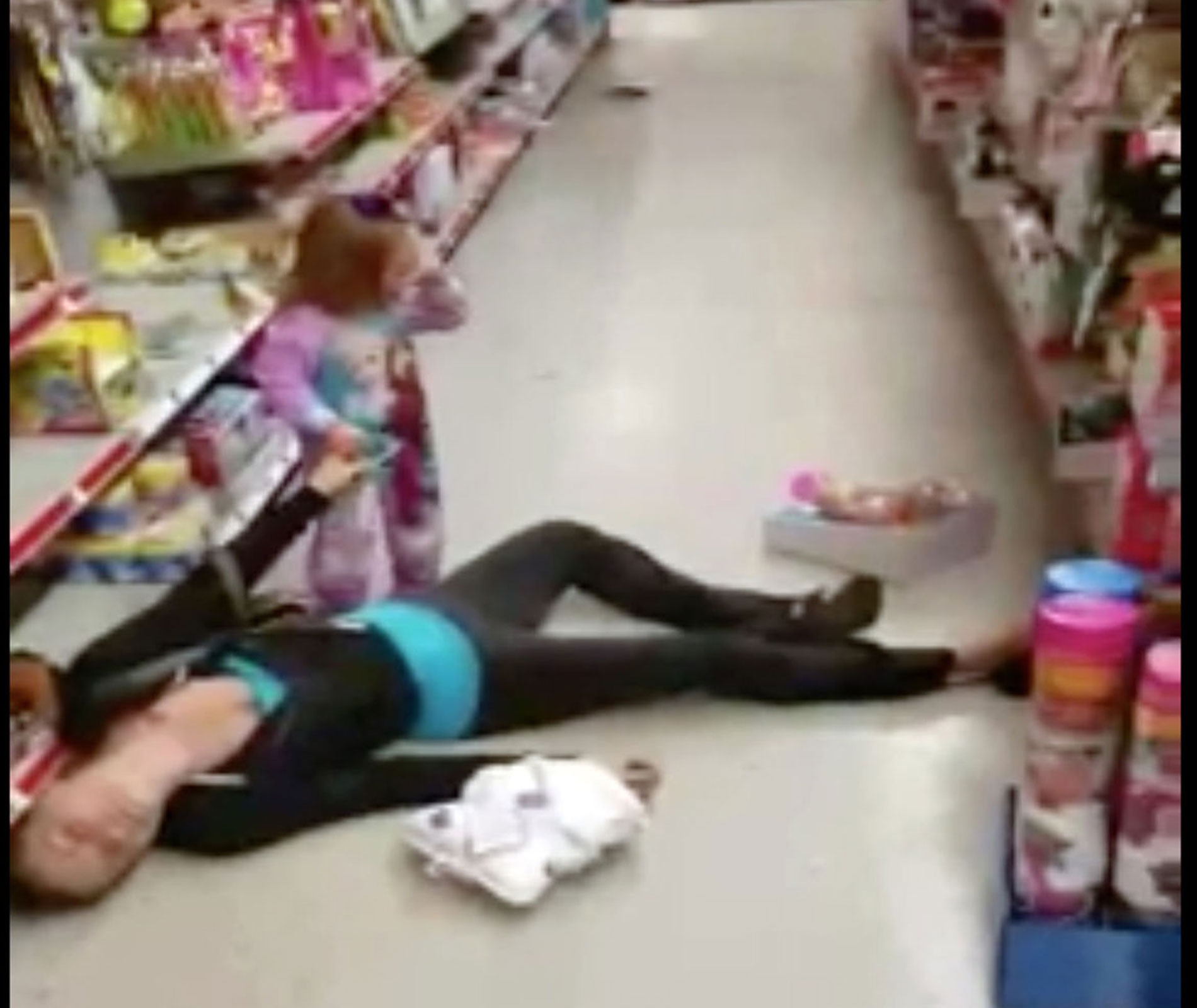 Toddler tries to wake mum from apparent overdose in discount store