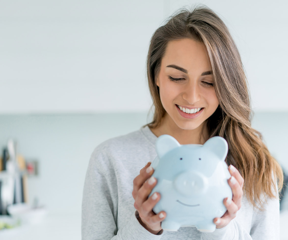 Woman saving money piggybank