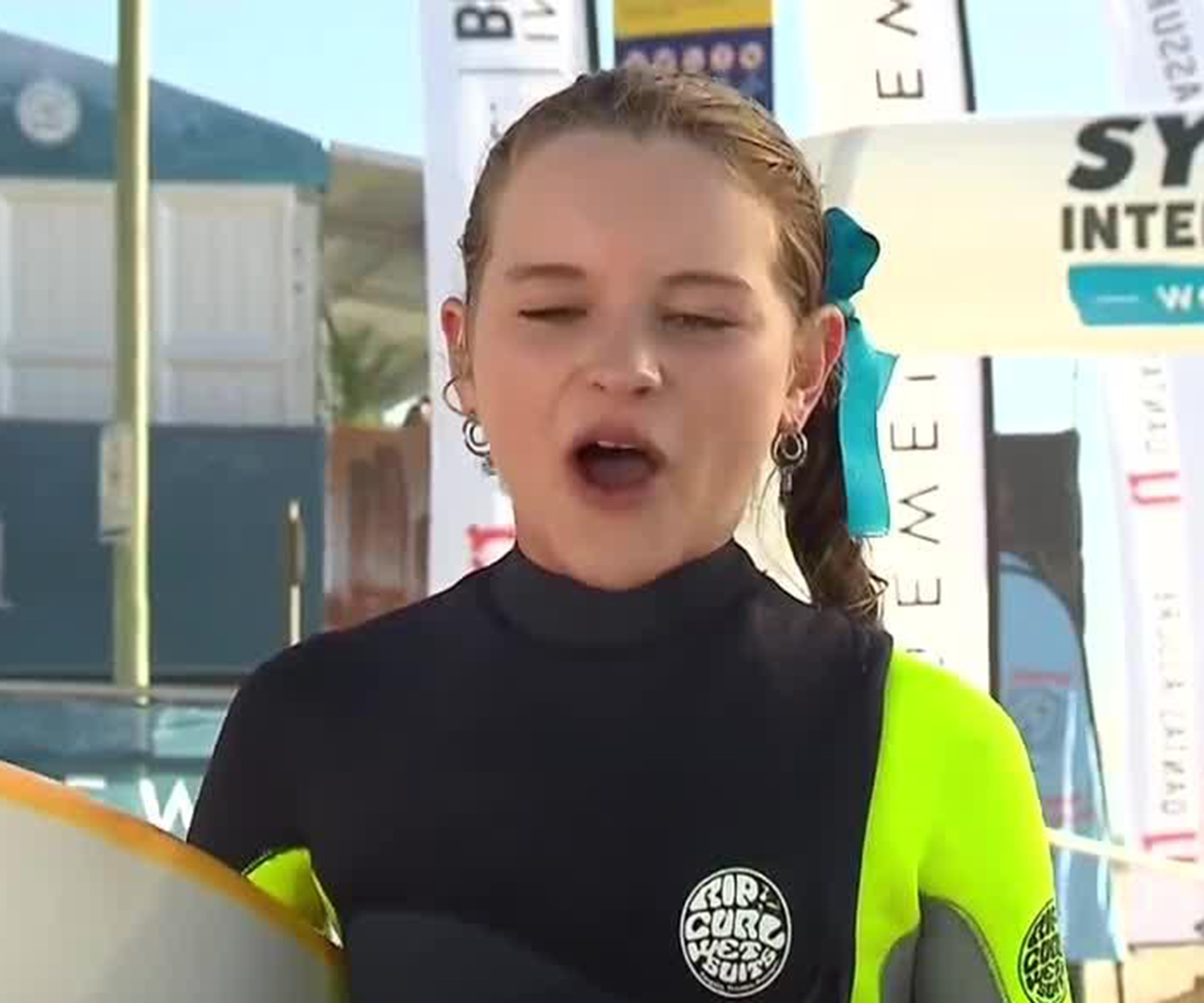 Cheeky Aussie surfer takes pot shots at her dad during live TV interview