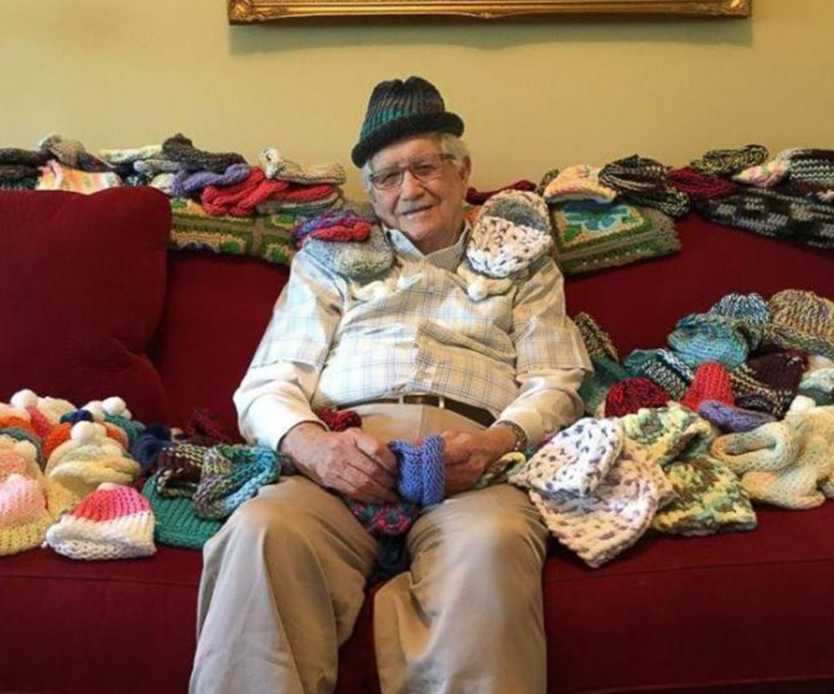 Sweet, elderly man knits beanies for premature babies.