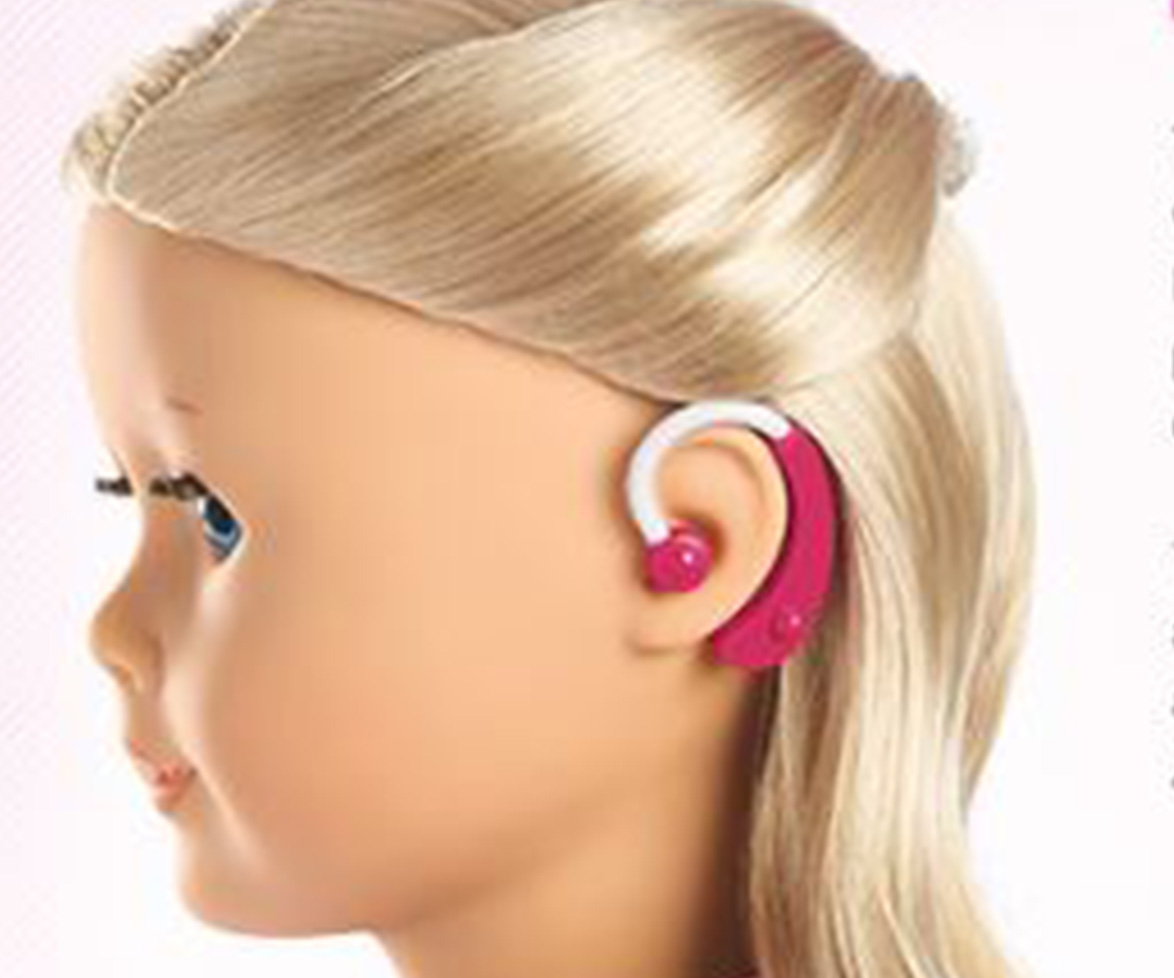 Doll with a hearing aid