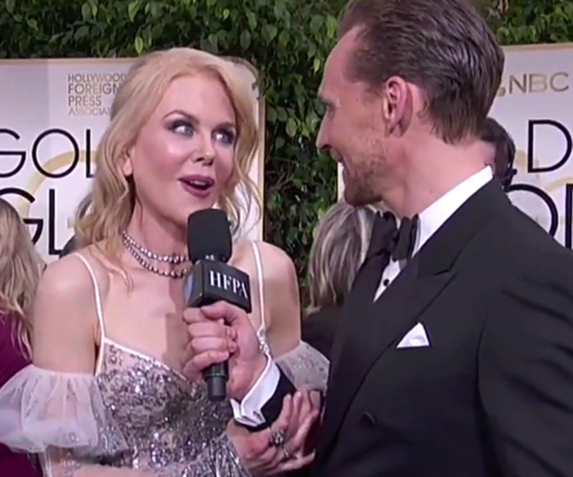 Watch Nicole Kidman hilariously interrupt Tom Hiddleston’s interview on the Golden Globes red carpet
