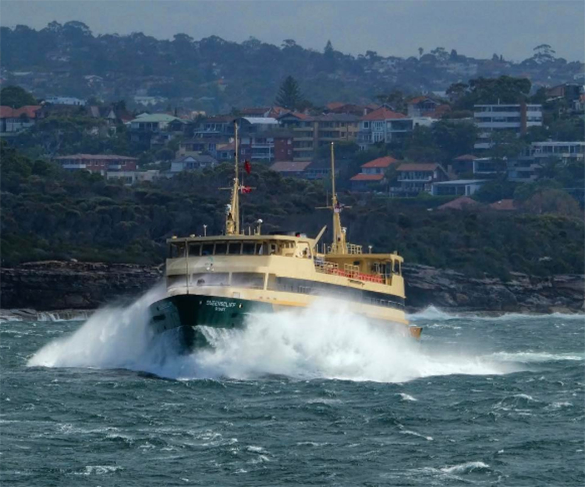 Sydney deckhand captures incredible image of gigantic waves crashing into the Manly ferry