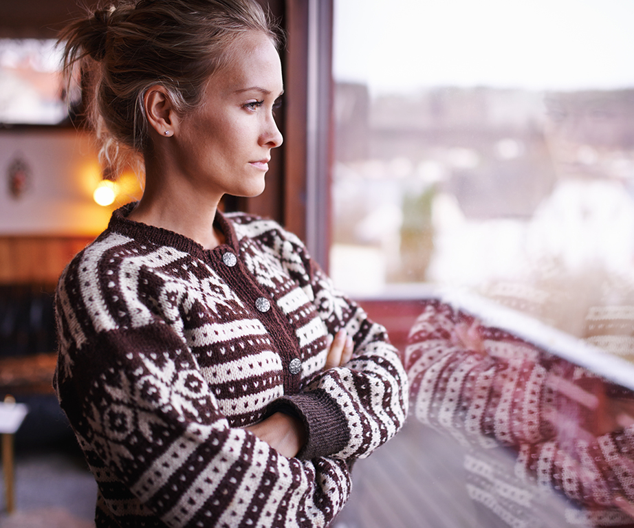 Woman staring out of window