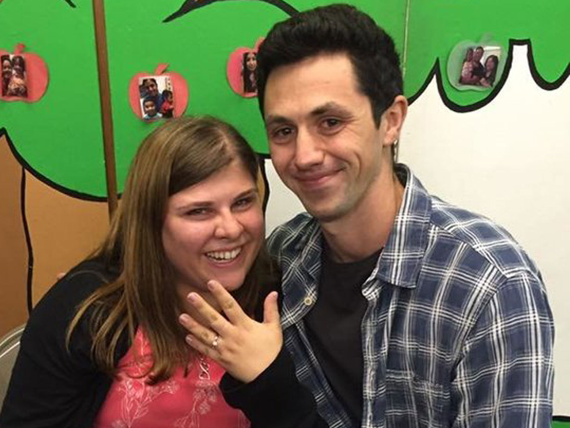 Eric Hernandez proposes with book to Melanie Goldsmith 