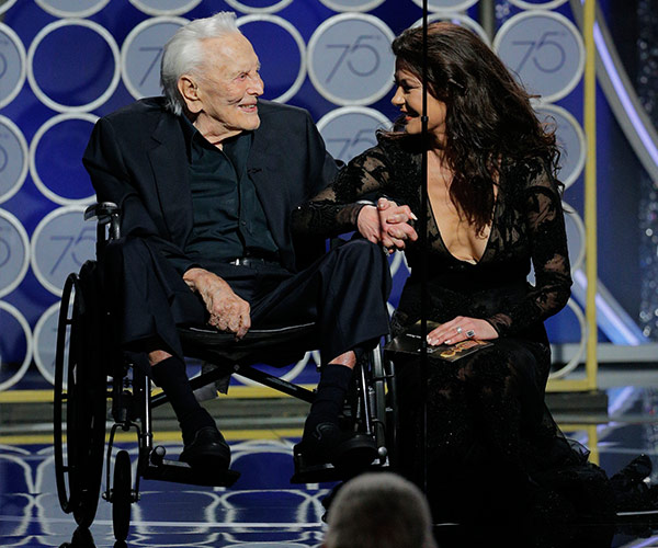Our hearts! 101-year-old Kirk Douglas presents an award with daughter-in-law Catherine Zeta Jones at the Globes