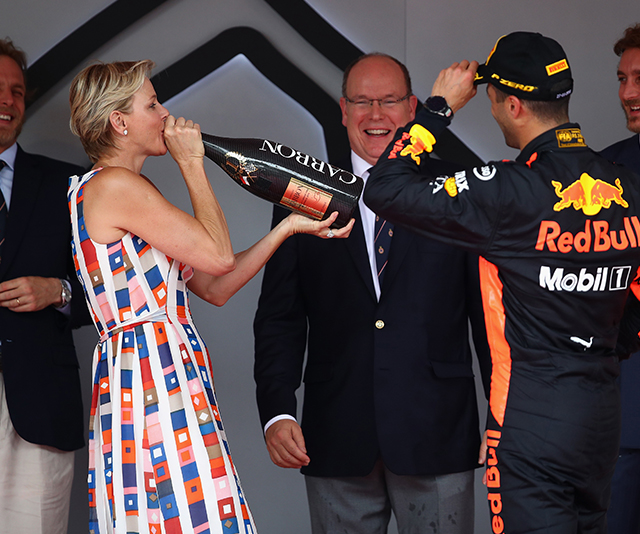 Bottoms up! Princess Charlene downs champagne at the Monaco Grand Prix
