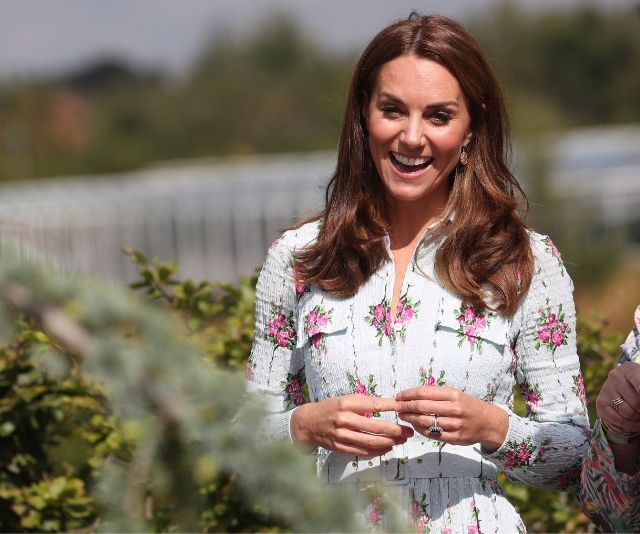 Duchess Catherine makes a dazzling summery entrance on a tractor as she attends vibrant garden festival