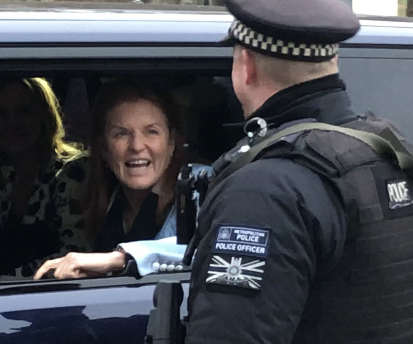 Sarah Ferguson is all smiles as she heads to Buckingham Palace for crisis talks